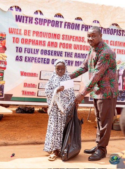 Young girl receiving food and clothing support
