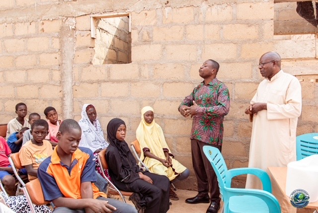 WHSF leaders addressing orphans and guardians at the gathering