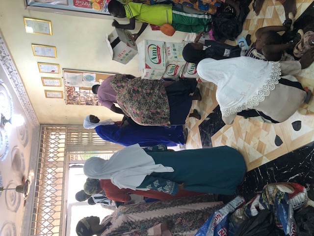 Volunteers organizing food parcels and supplies for distribution
