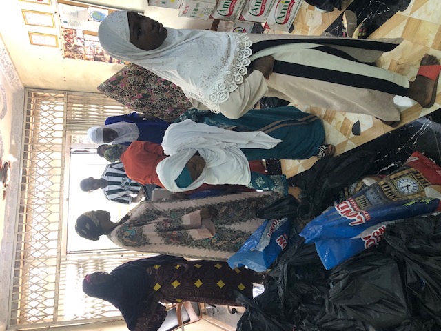 Women collecting their food and clothing packages