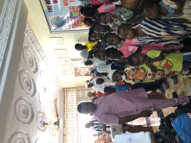 WHSF coordinator with the children at the community center
